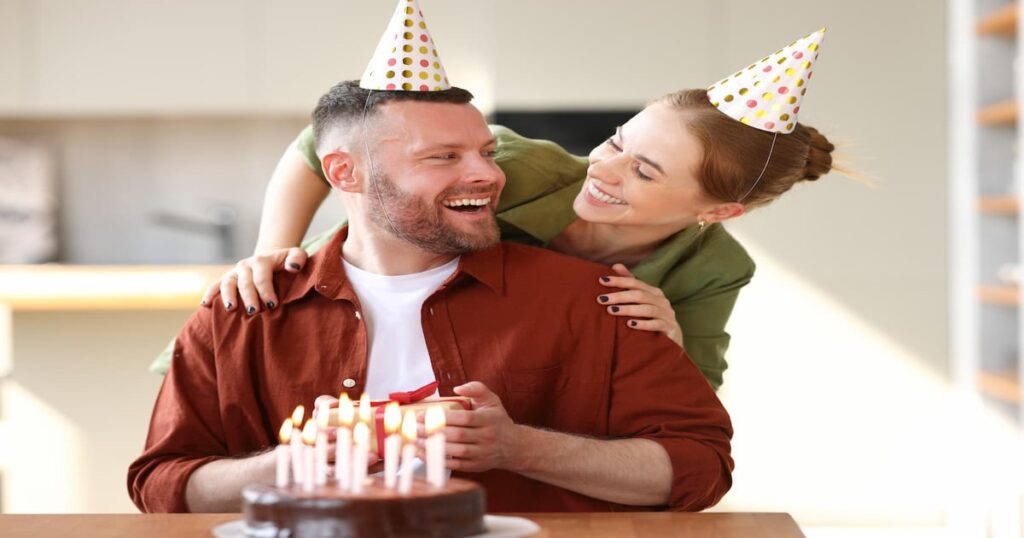 a man and woman with hats on
