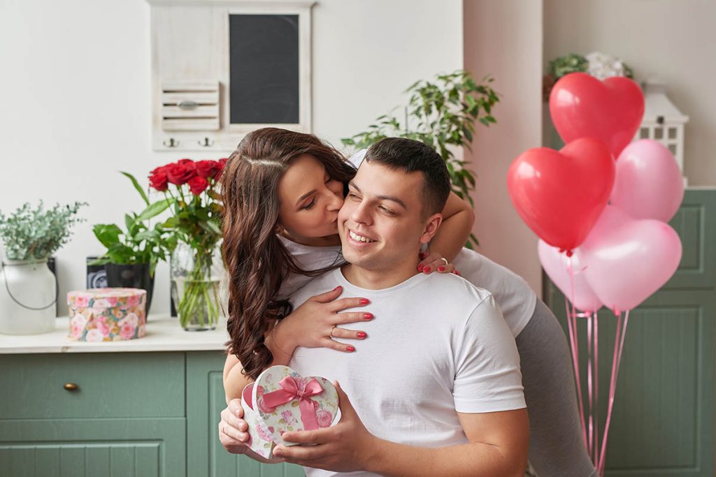 a woman kissing a man